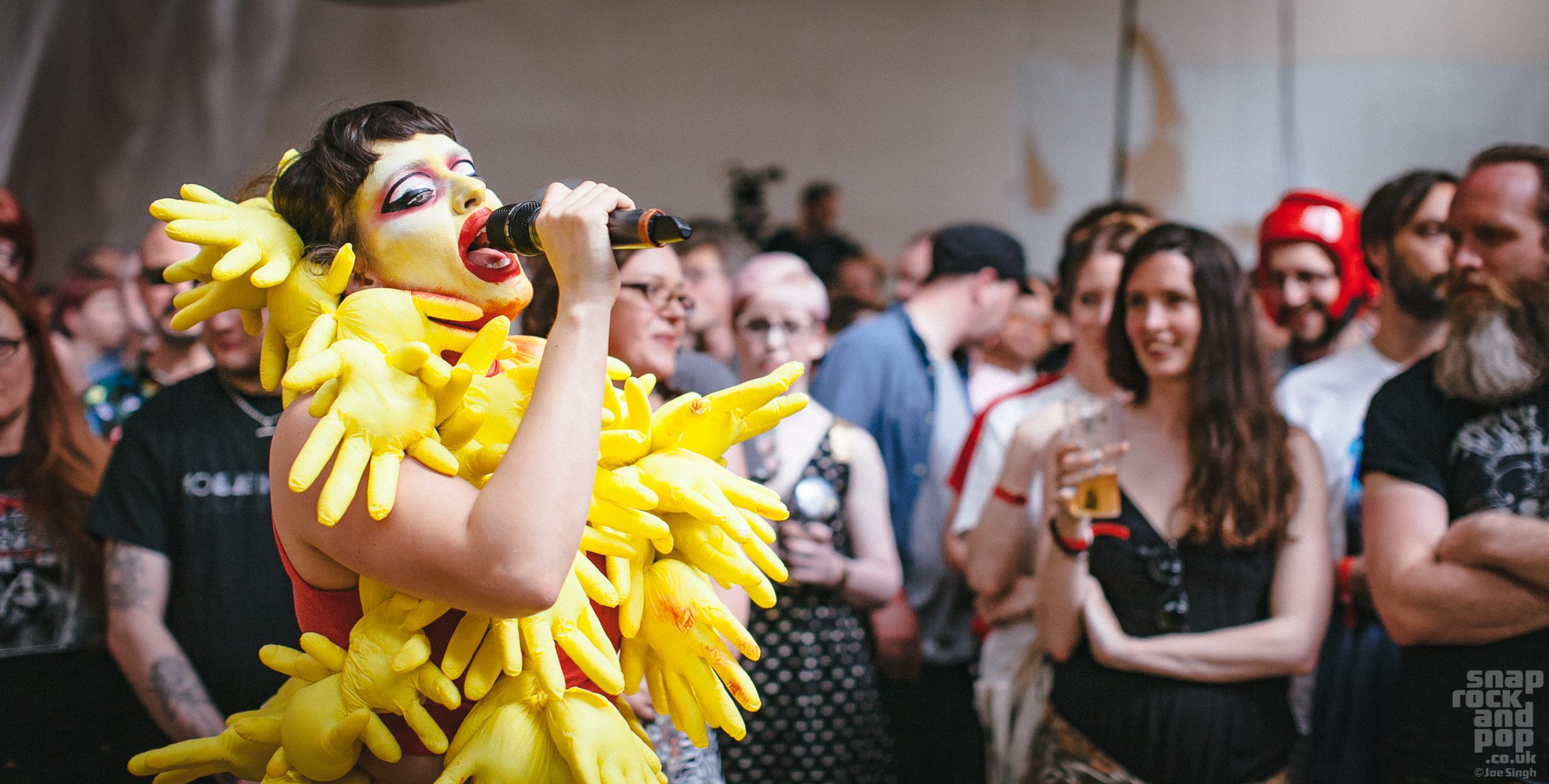 Natalie sharp aka. Lone Taxidermist performing at Supersonic Festival 2017 in a yellow costume